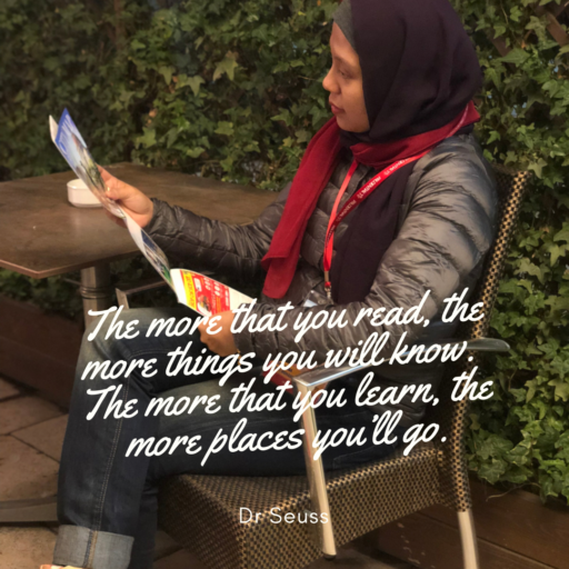 Blog owner sitting on an outdoor chair, perusing a map